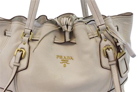 prada milano bag very stiff leather with all leathe handles|Prada leather handbags.